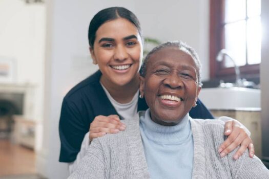 Healthcare worker smiling with patient