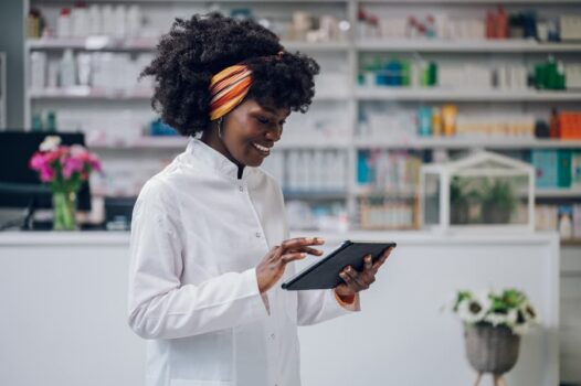 Cheerful young person working in pharmacy
