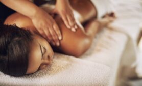 Content client receiving massage therapy