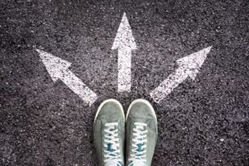 Top view of shoes and arrows pointing in different directions