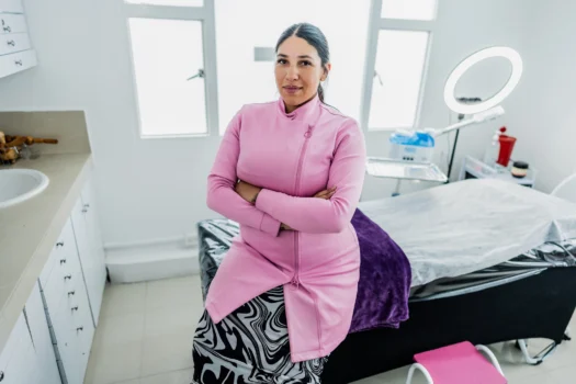Esthetician standing in front of treatment table