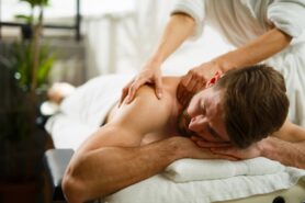 Person having back massage in health spa